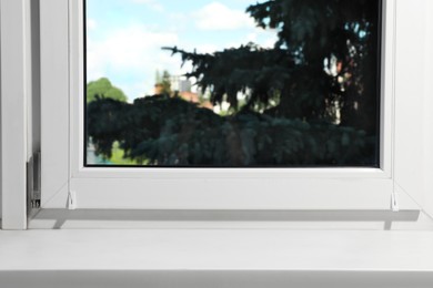 Photo of Window with empty white sill, closeup view