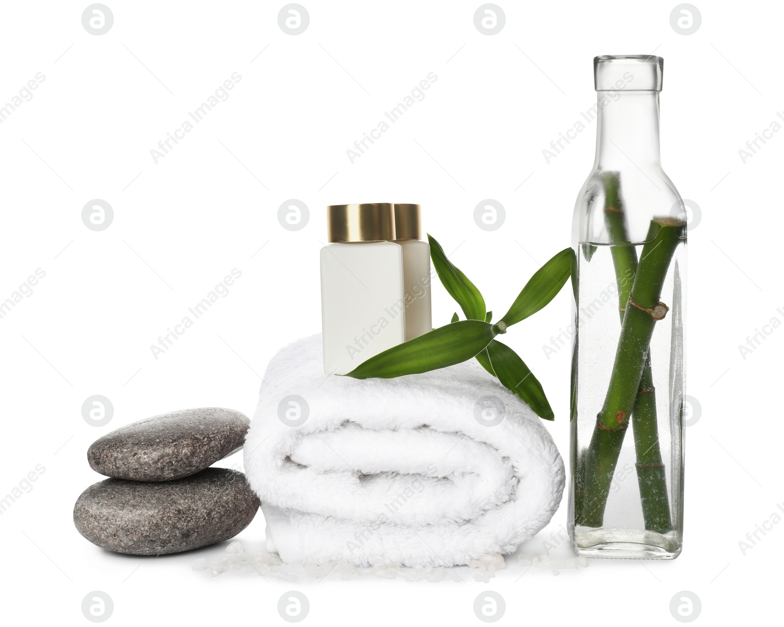 Photo of Composition with fresh bamboo, cosmetic products and spa stones on white background