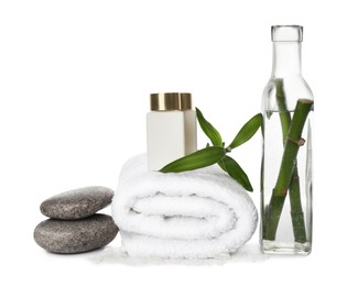 Photo of Composition with fresh bamboo, cosmetic products and spa stones on white background