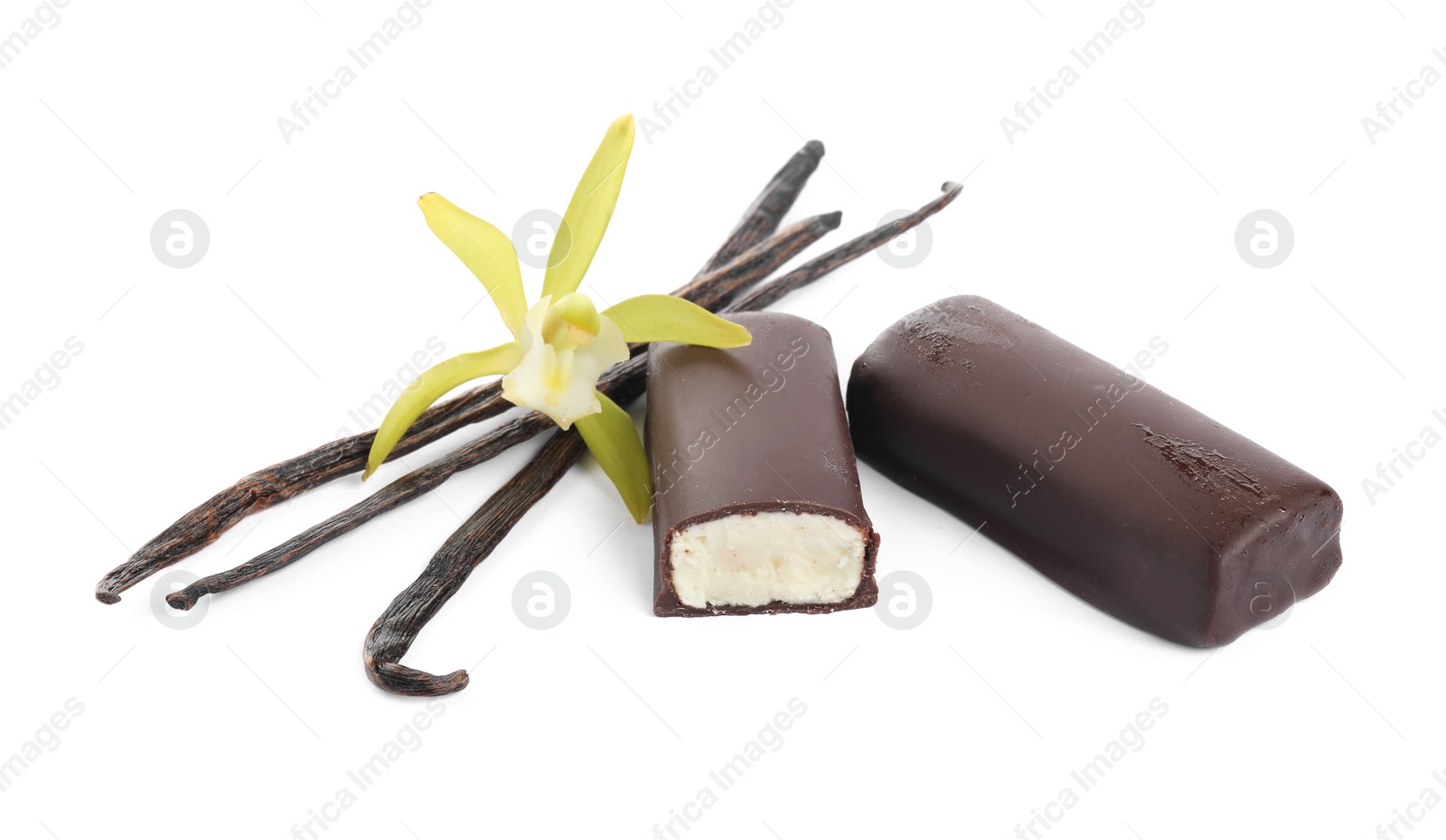 Photo of Glazed curd cheese bars, vanilla pods and flower isolated on white