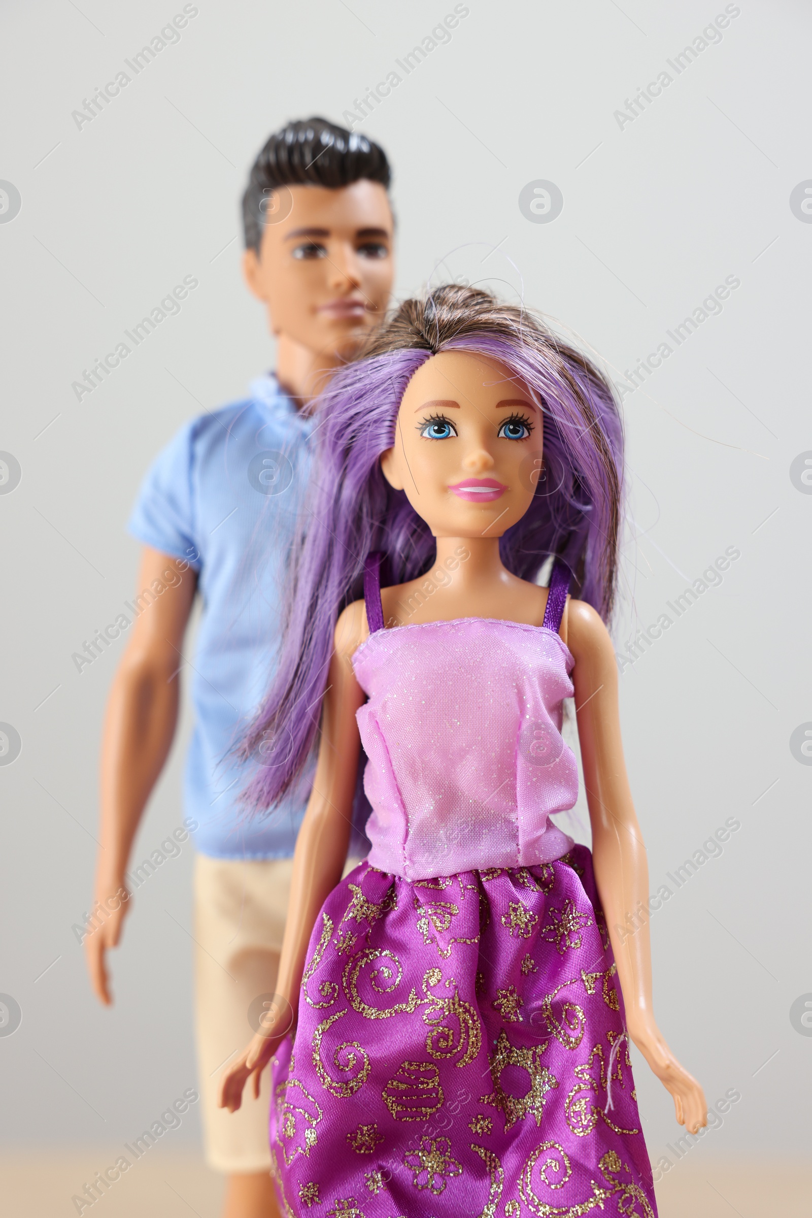 Photo of Leiden, Netherlands - September 20, 2023: Stylish Barbie and Ken dolls on light gray background, selective focus