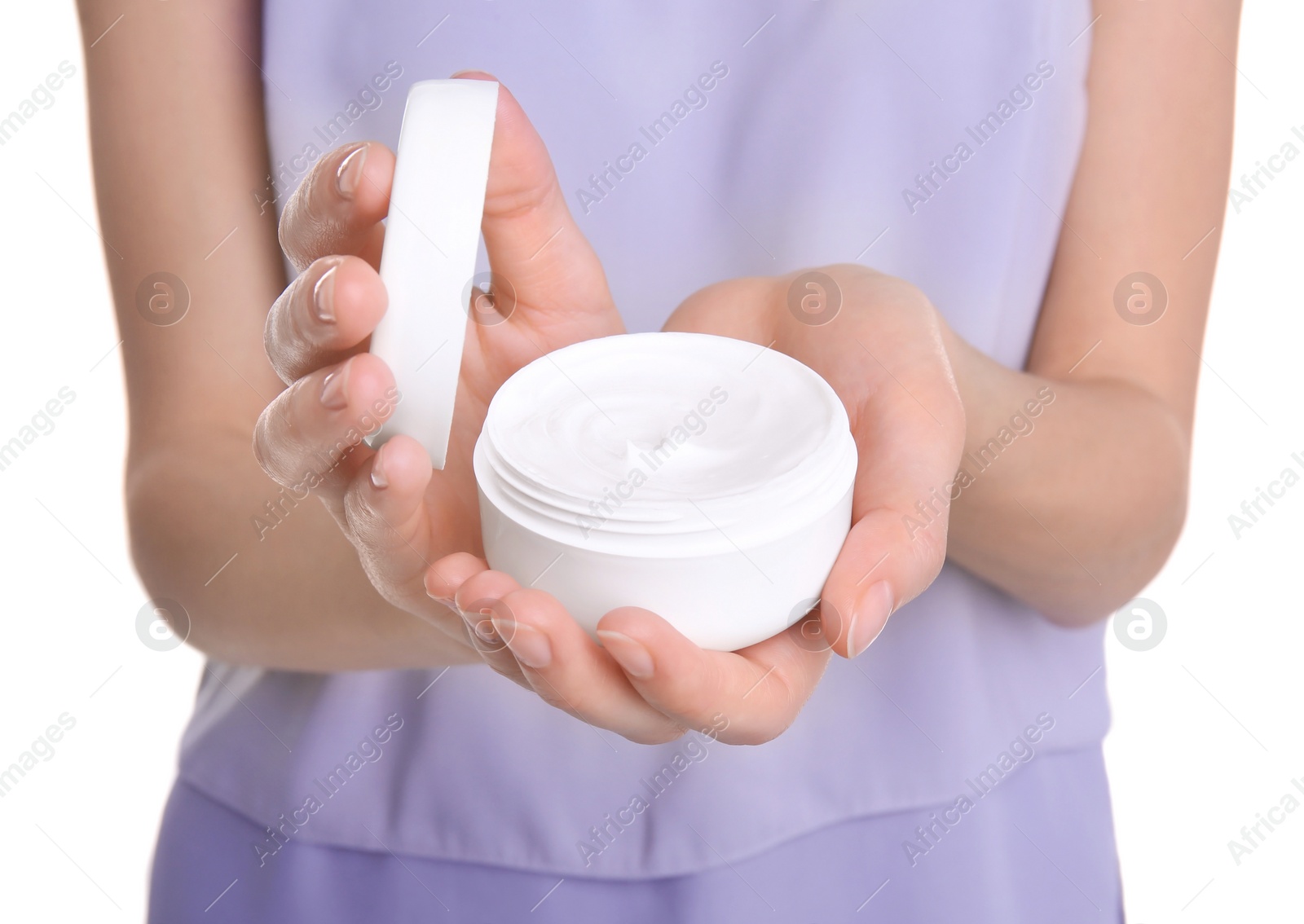 Photo of Young woman holding jar with hand cream, closeup