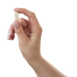 Photo of Woman holding vitamin pill on white background, closeup. Health supplement