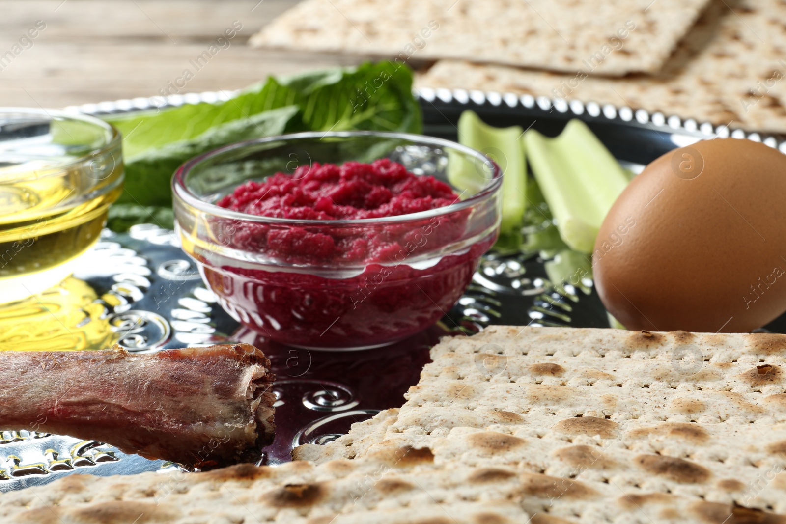 Photo of Closeup view of Passover Seder plate (keara) with traditional meal. Pesah celebration