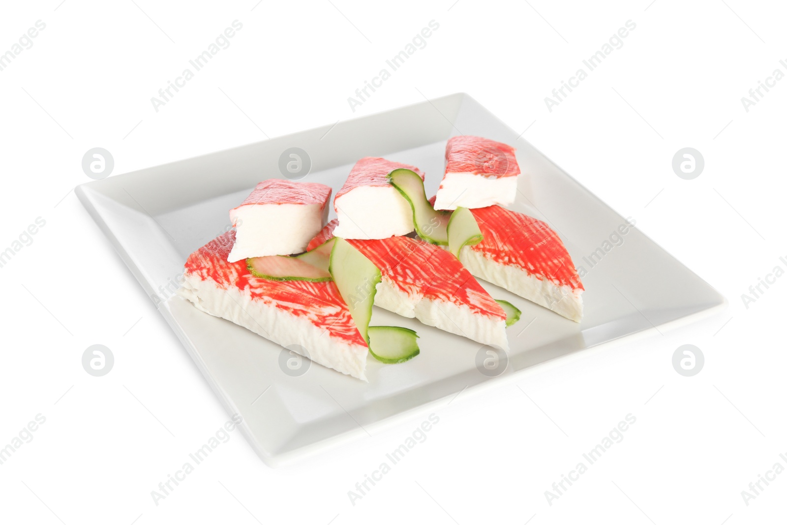 Photo of Fresh crab sticks with cucumber isolated on white