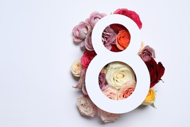 Photo of 8 March greeting card design with roses on white background, top view. Happy International Women's Day
