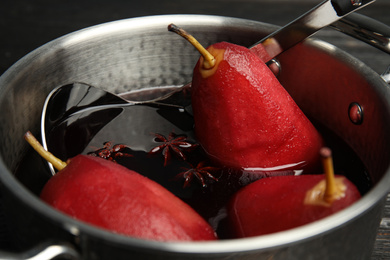 Image of Poaching pears in mulled wine, closeup view