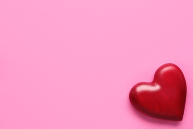 Red decorative heart and space for text on pink background, top view. Valentine's Day