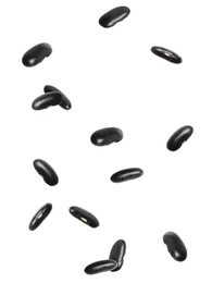 Many black beans falling on white background. Vegan diet 