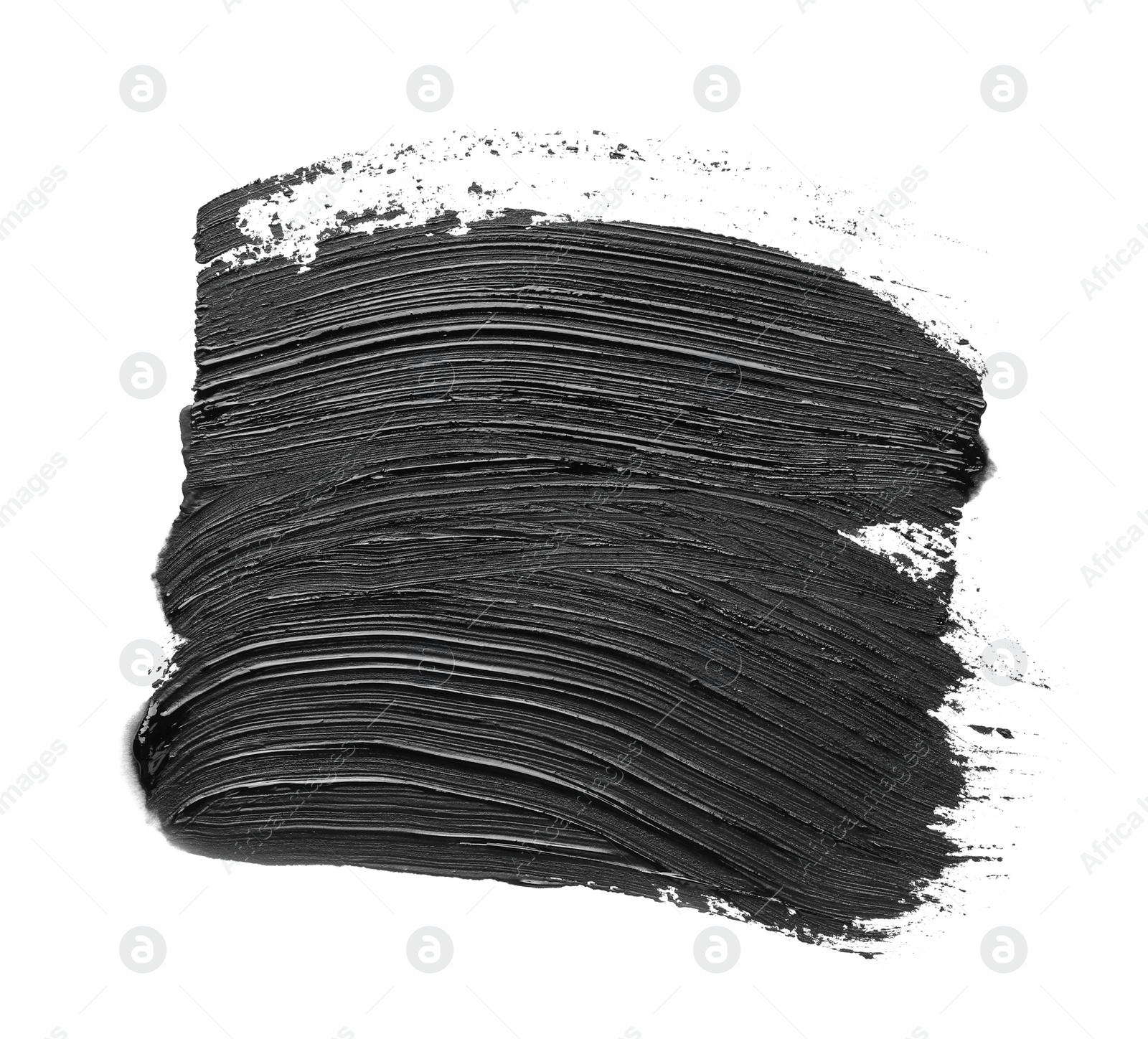 Photo of Brushstrokes of black oil paint on white background, top view