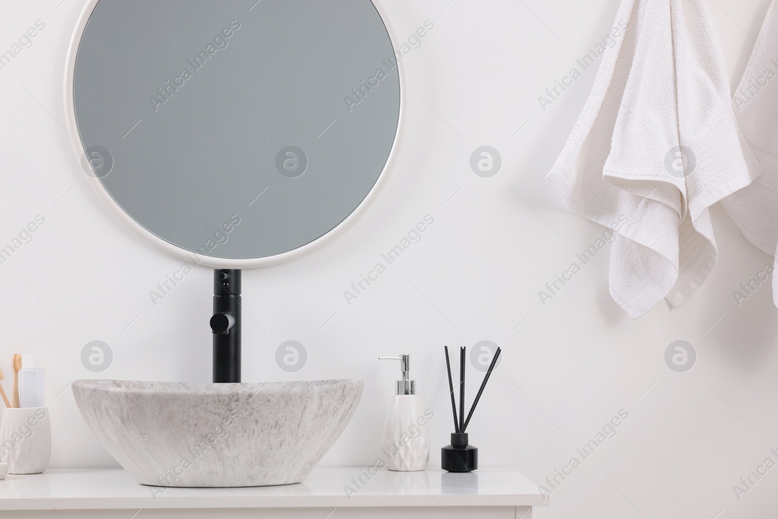 Photo of Different bath accessories and personal care products in bathroom