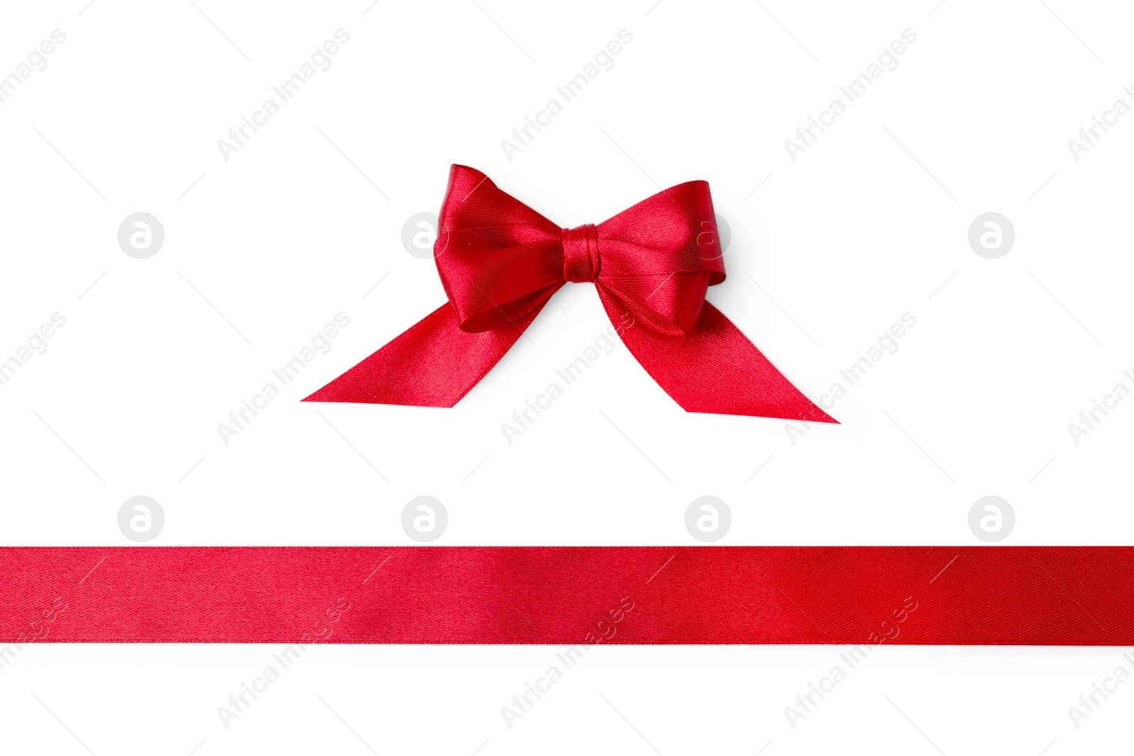 Photo of Red satin ribbon and bow on white background, top view