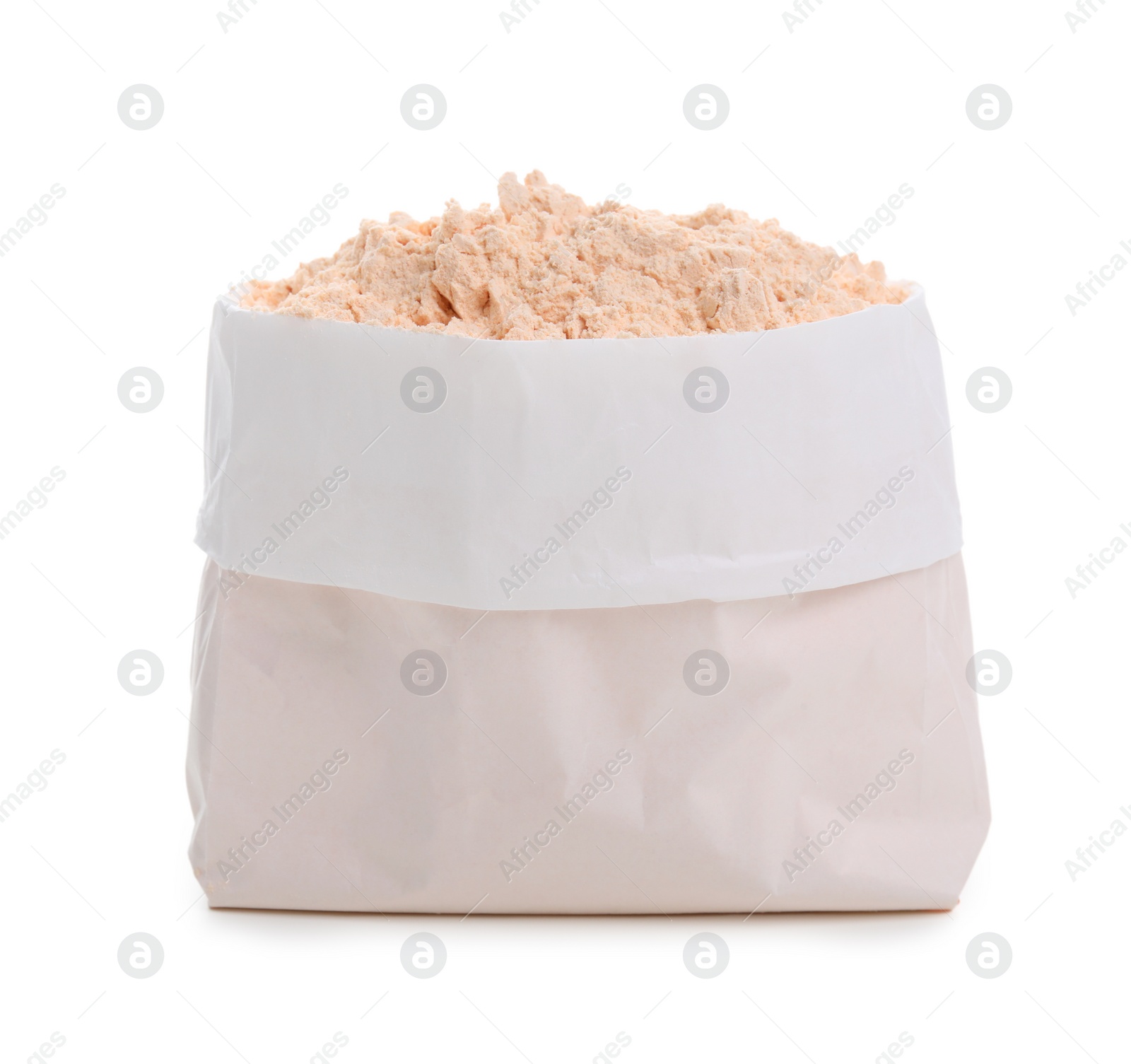 Photo of Lentil flour in paper bag isolated on white