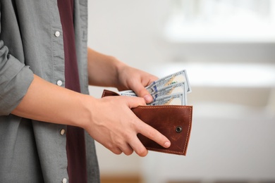 Photo of Man with American money in wallet, closeup