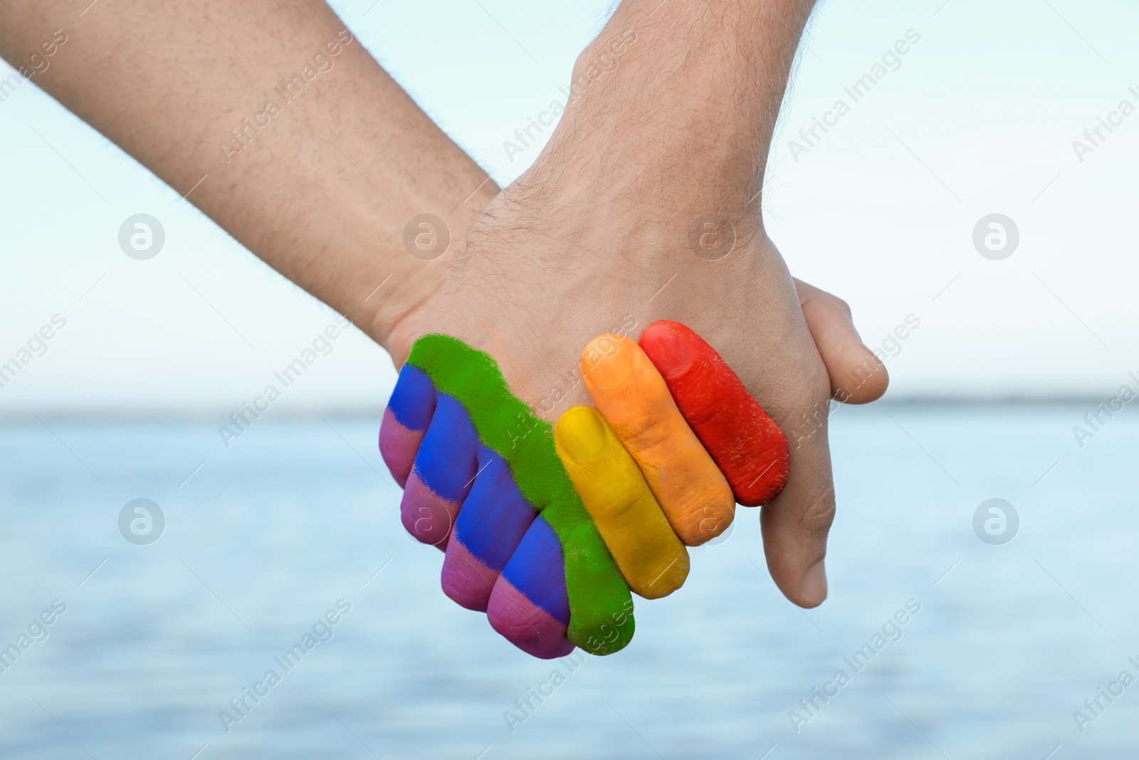 Image of Gay couple near river on sunny day, closeup