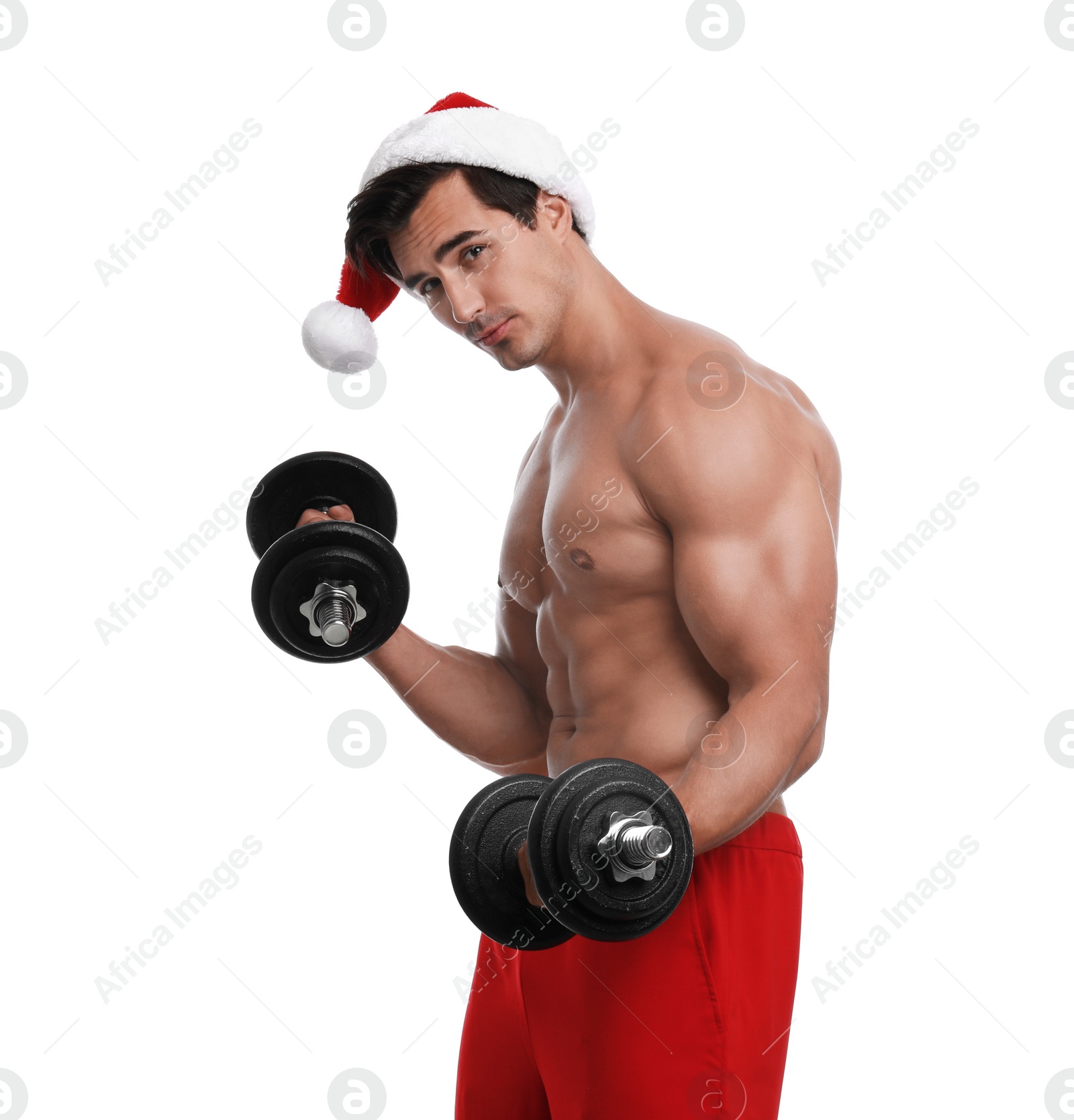 Photo of Sexy shirtless Santa Claus with dumbbells on white background