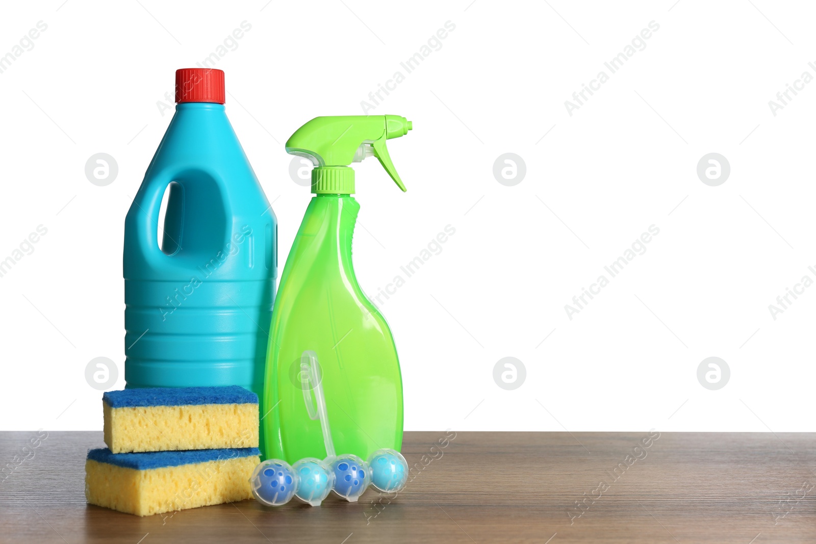 Photo of Composition with different toilet cleaning tools on wooden table against white background. Space for text