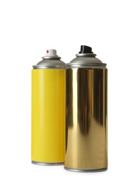 Photo of Cans of different spray paints on white background