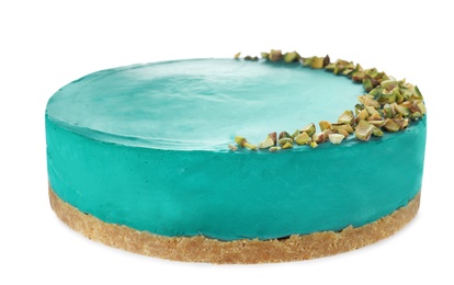 Delicious spirulina cheesecake decorated with pistachios isolated on white