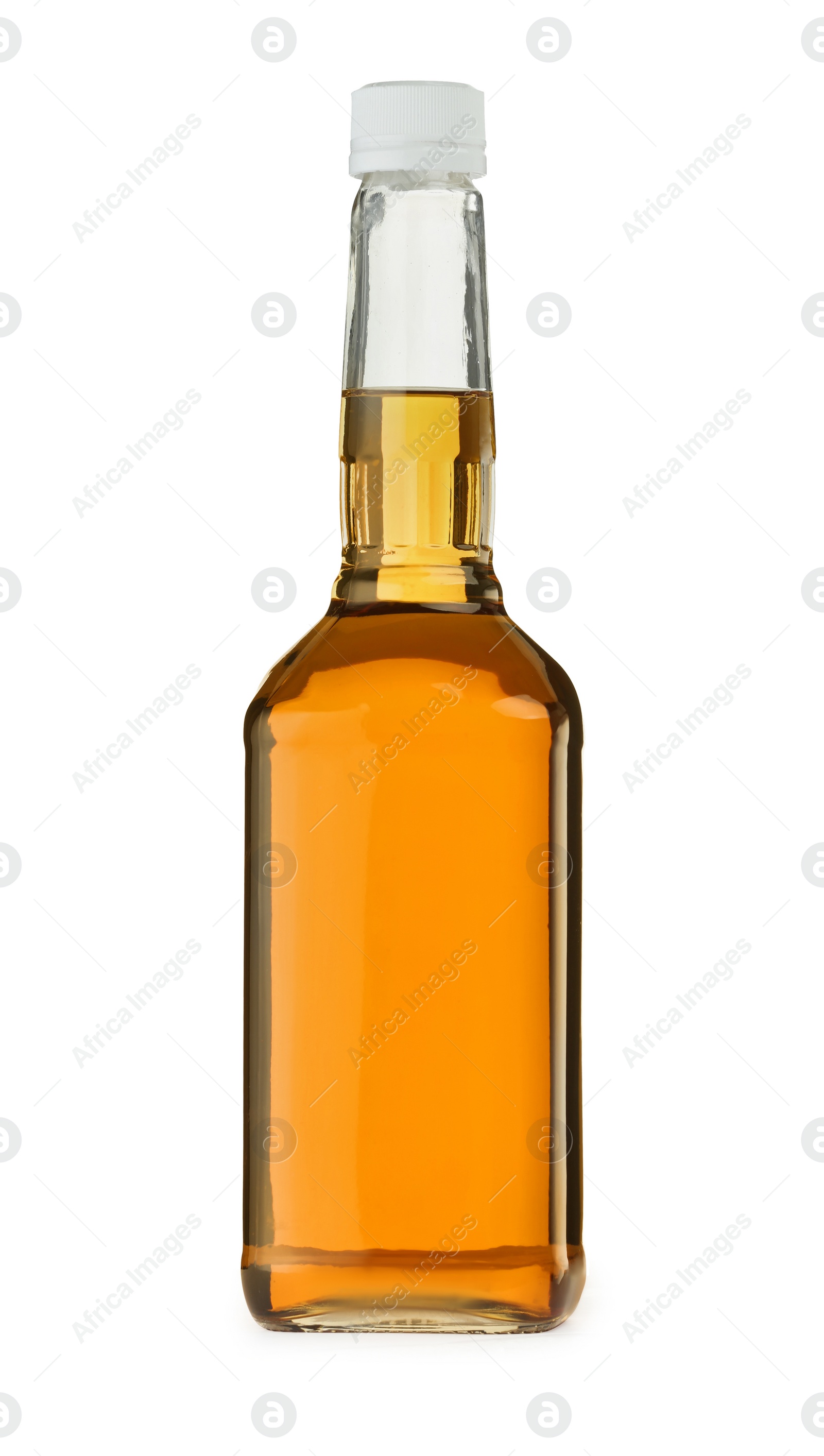 Photo of Whiskey in glass bottle isolated on white