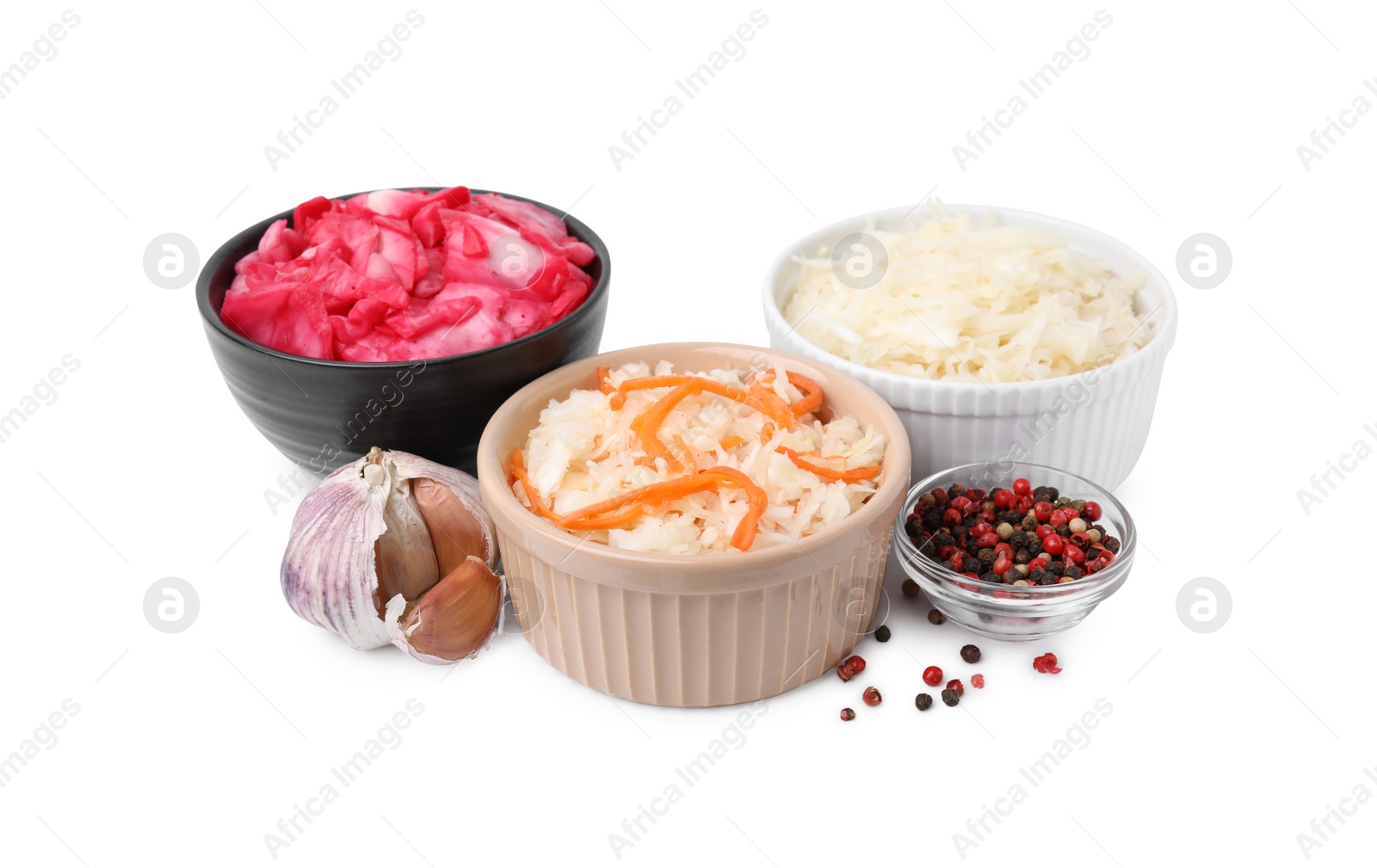 Photo of Delicious sauerkraut prepared according to different recipes and spices on white background