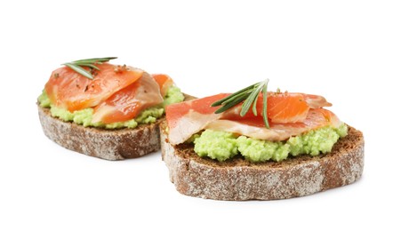 Photo of Delicious sandwiches with salmon, avocado and rosemary on white background