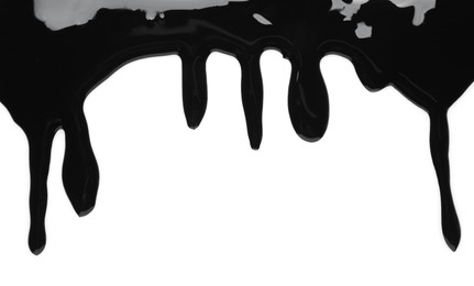 Black glossy paint spilled on white background, top view