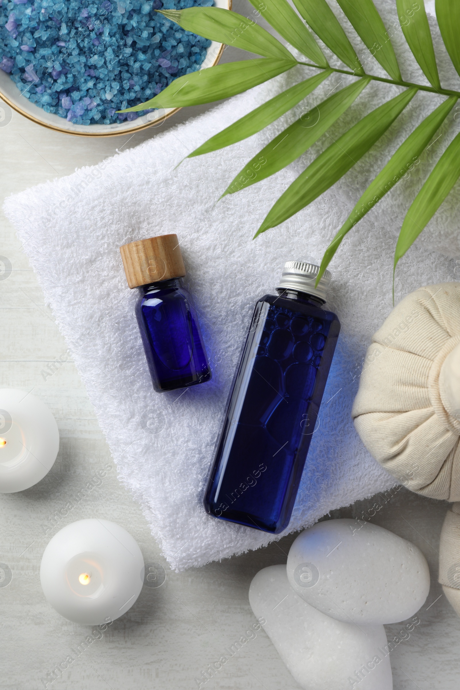 Photo of Flat lay composition with spa products on light wooden table