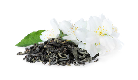 Photo of Dry green tea and fresh jasmine flowers isolated on white