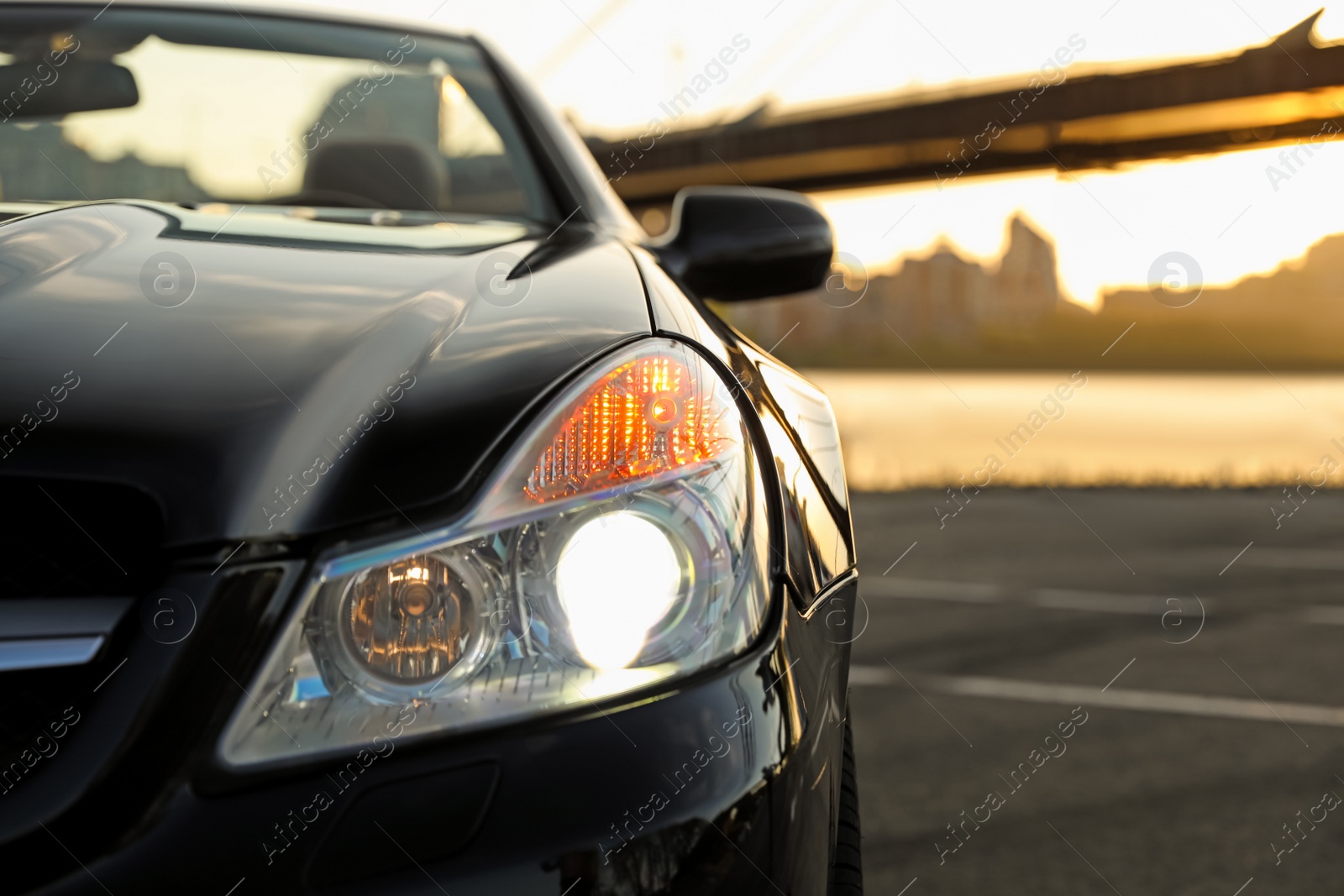 Photo of Luxury black convertible car outdoors, closeup view