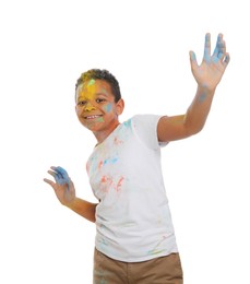 Photo of African American boy covered with colorful powder dyes on white background. Holi festival celebration