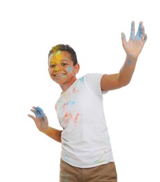 African American boy covered with colorful powder dyes on white background. Holi festival celebration