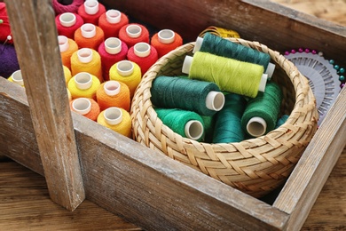 Photo of Box with color sewing threads, closeup