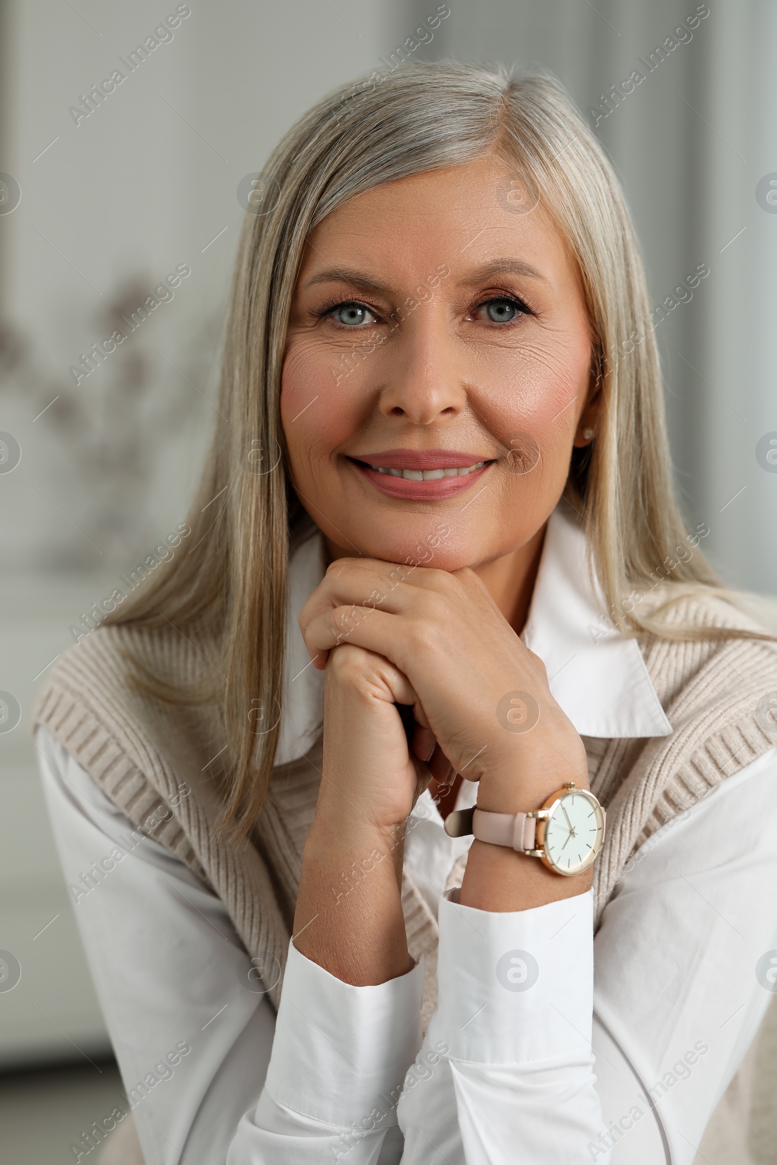 Photo of Portrait of beautiful middle aged woman indoors