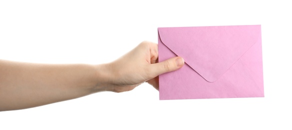 Woman holding pink paper envelope on white background, closeup