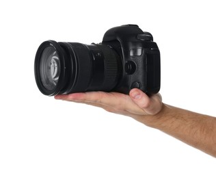 Photo of Photographer holding modern camera on white background, closeup