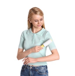 Photo of Young woman cleaning clothes with lint roller on white background