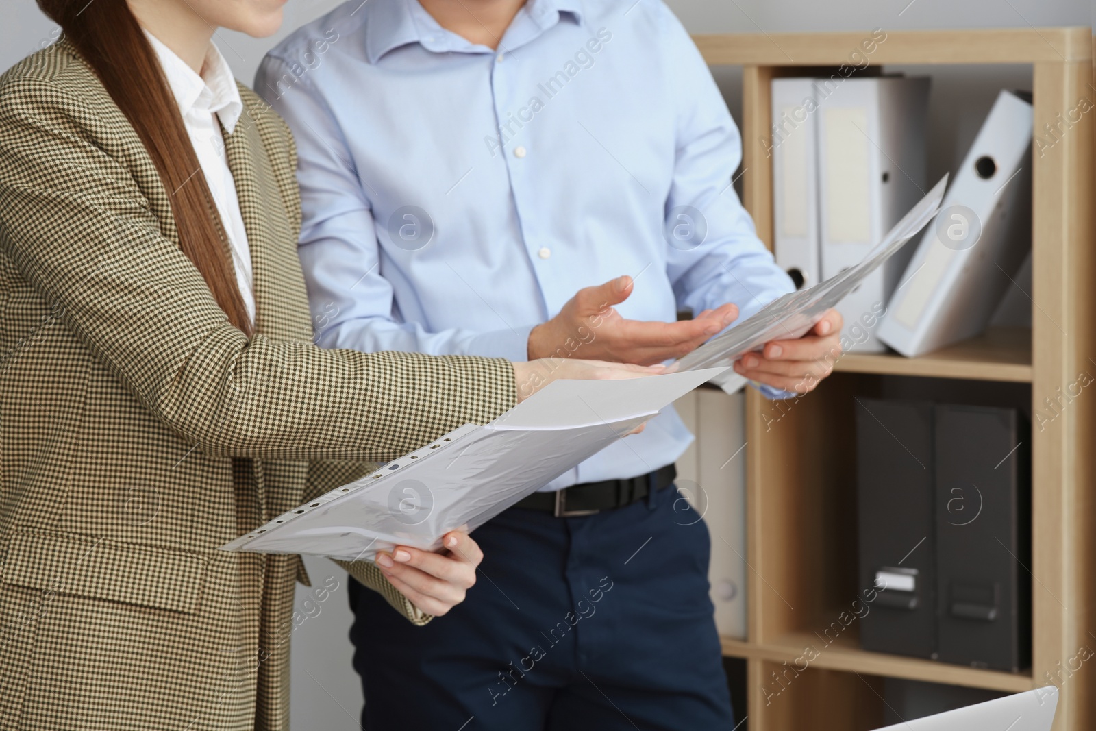 Photo of Businesspeople working with documents in office, closeup