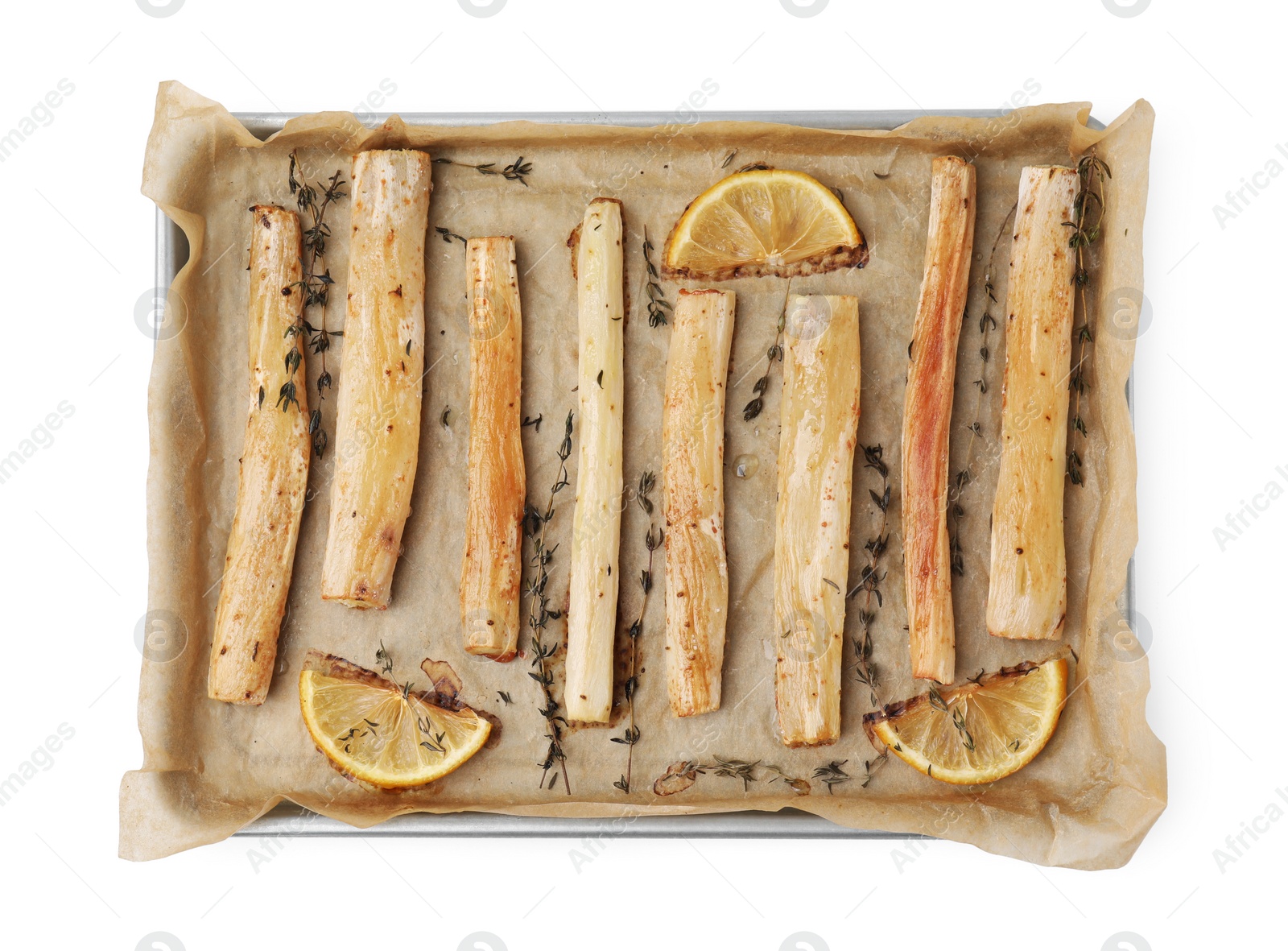 Photo of Baking tray with cooked salsify roots, lemon and thyme isolated on white, top view