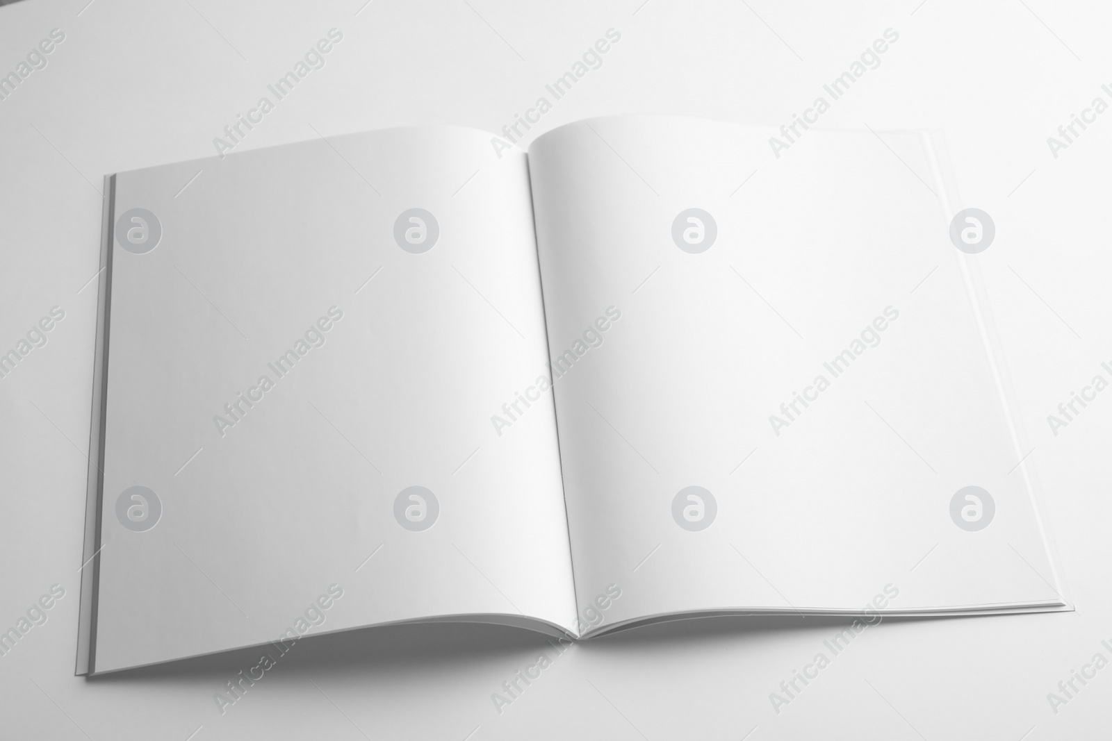 Photo of Blank open book on white background. Mock up for design