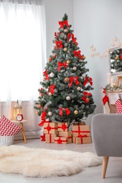 Photo of Stylish living room interior with decorated Christmas tree