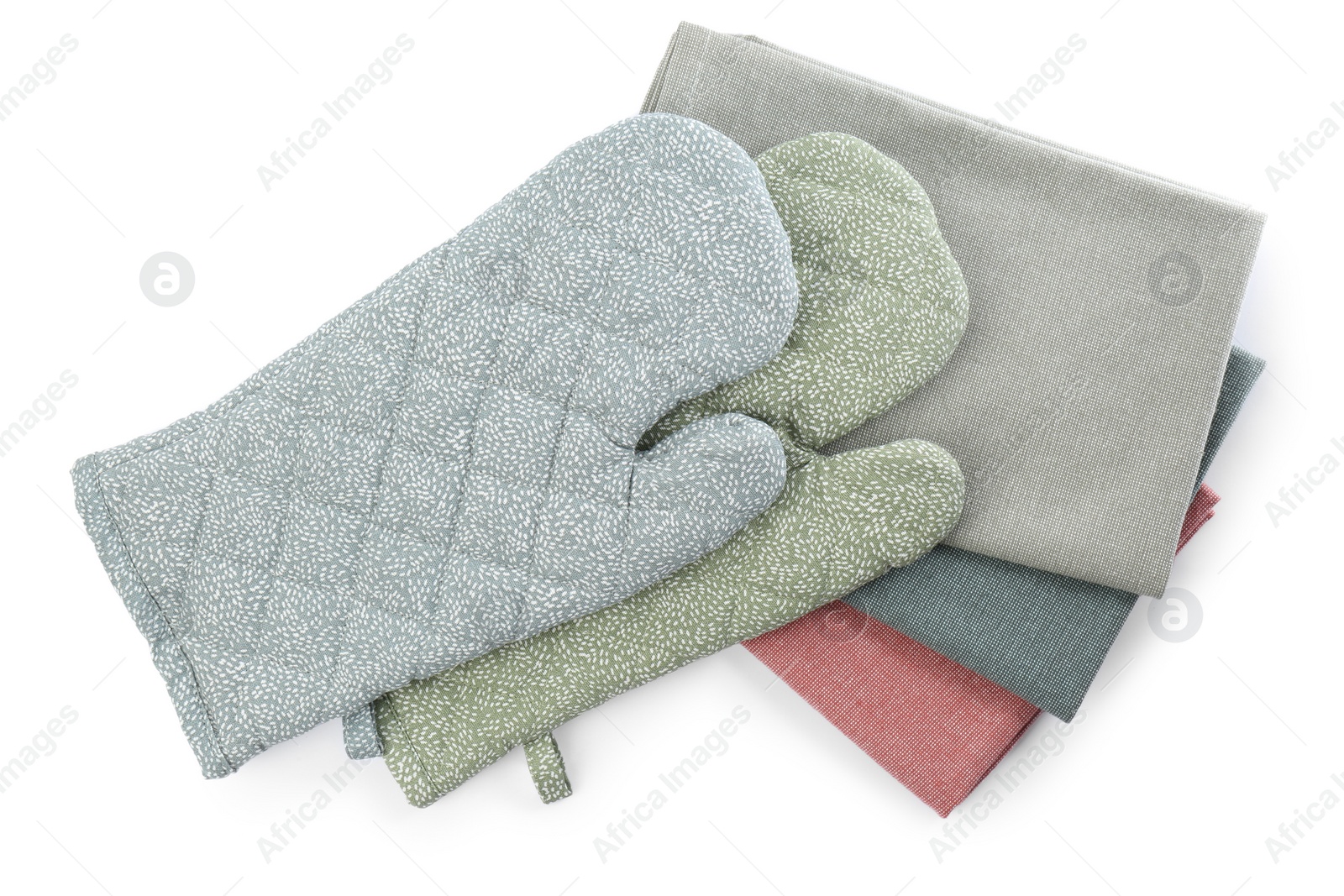 Photo of Kitchen towels and oven gloves for hot dishes on white background, top view