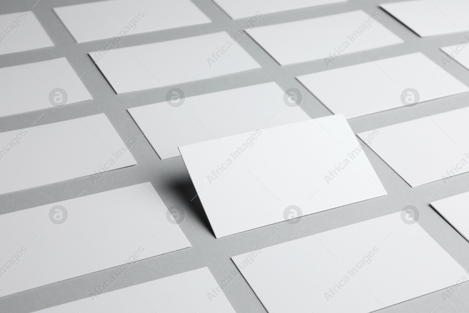 Photo of Blank business cards on light gray background, closeup. Mockup for design