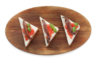 Photo of Delicious sandwiches with cream cheese, anchovies, tomatoes and basil on white background, top view