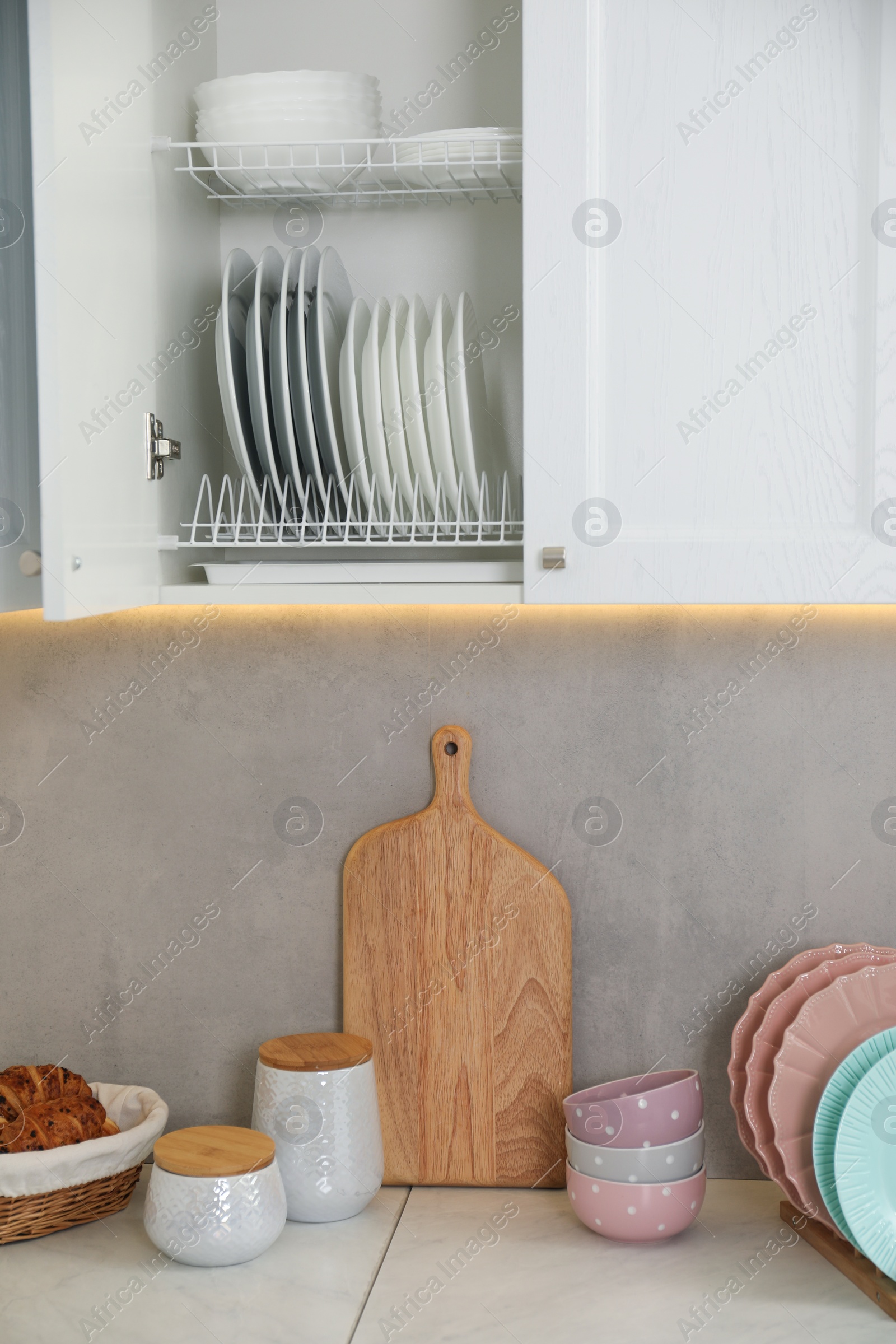 Photo of Clean plates, bowls and other kitchenware indoors