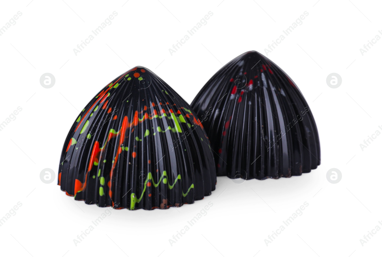 Photo of Two tasty chocolate candies on white background