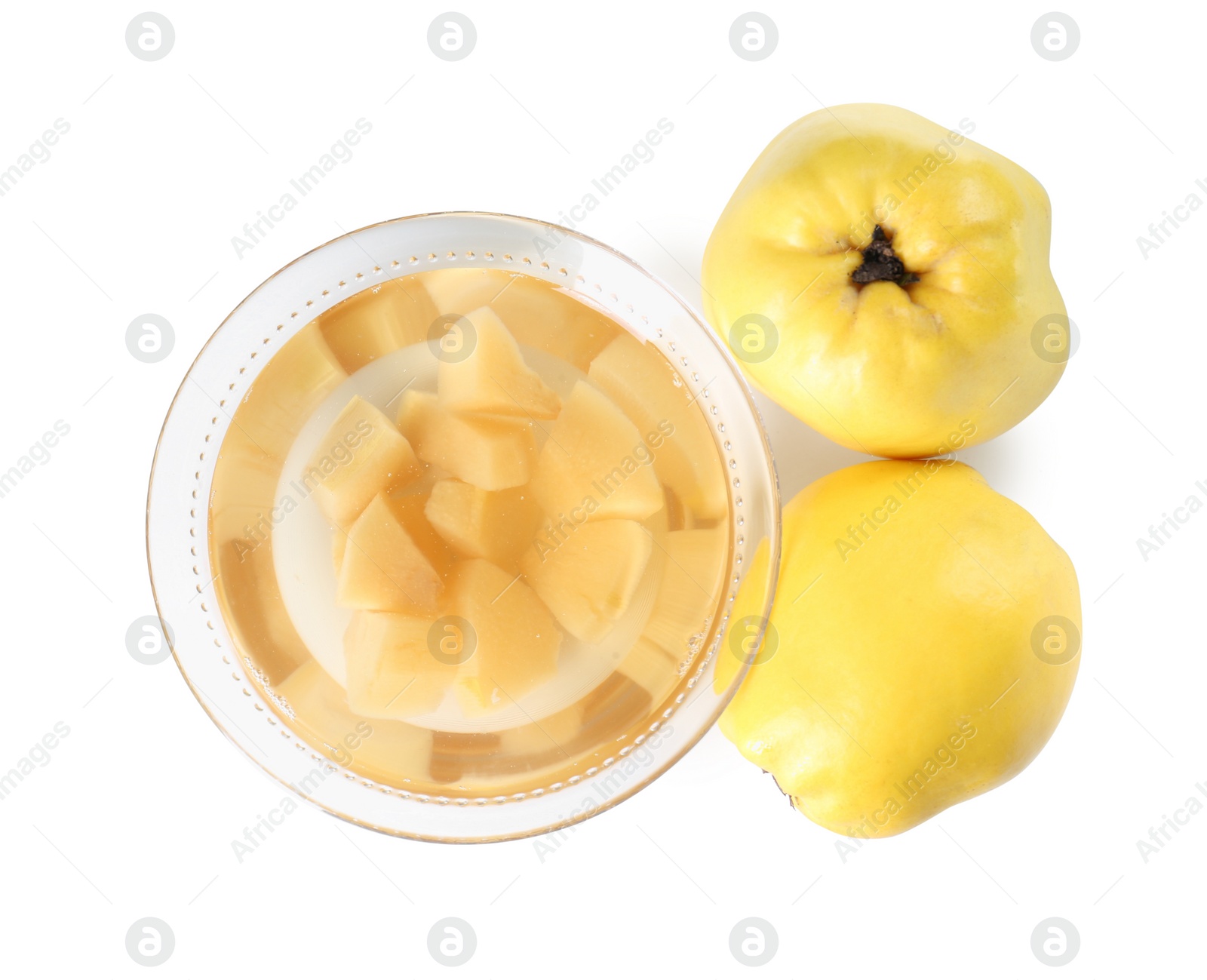 Photo of Delicious quince drink in glass bowl and fresh fruits isolated on white, top view