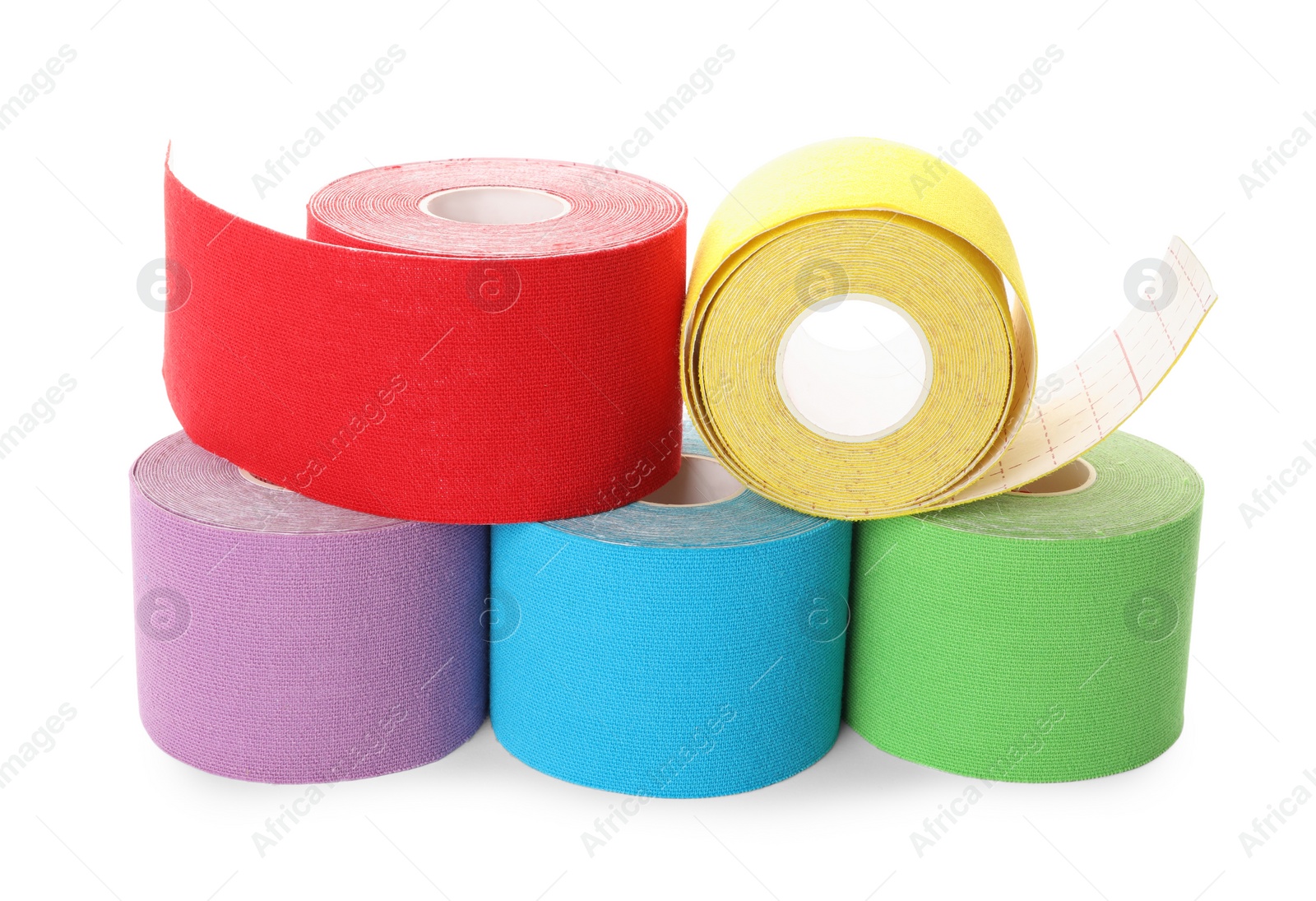 Photo of Many bright kinesio tape in rolls on white background