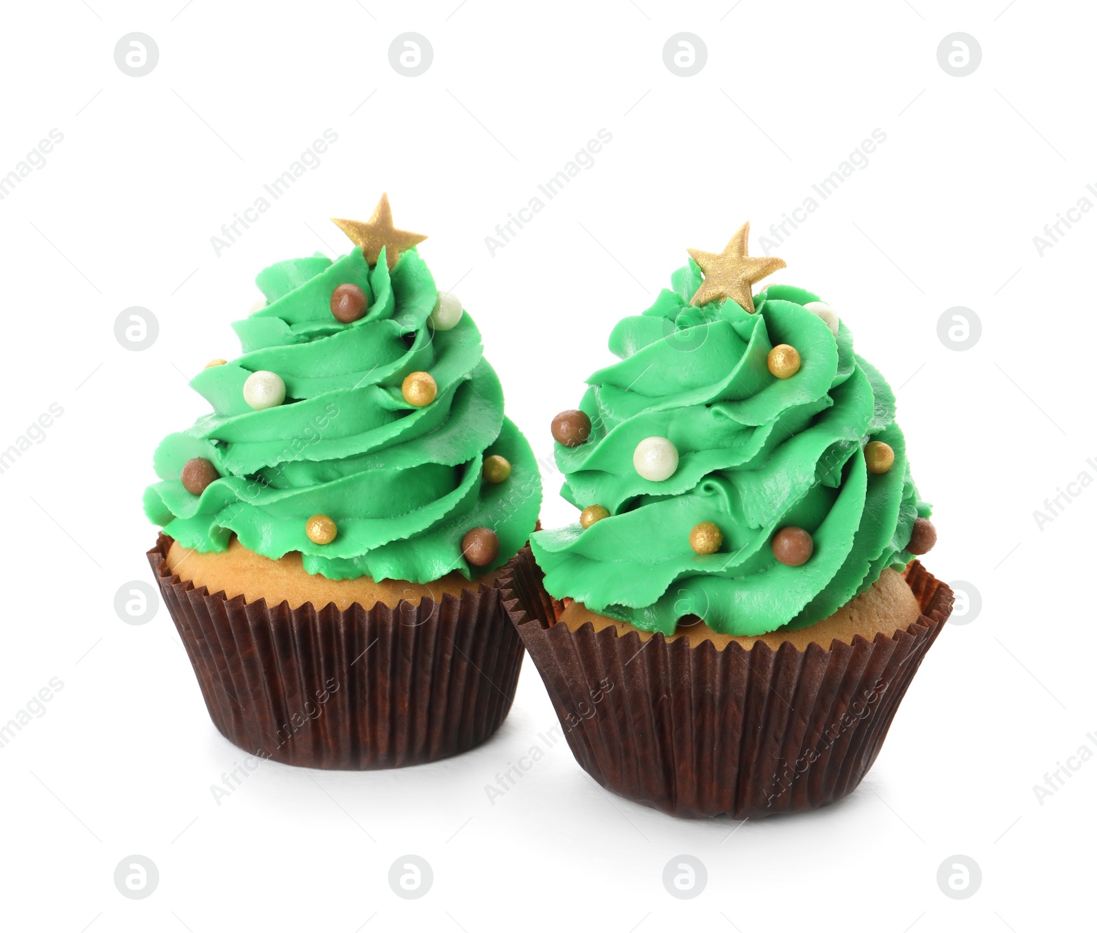 Photo of Tasty Christmas tree cupcakes on white background