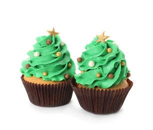 Photo of Tasty Christmas tree cupcakes on white background